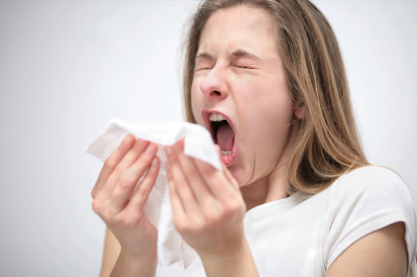 Women Sneezing